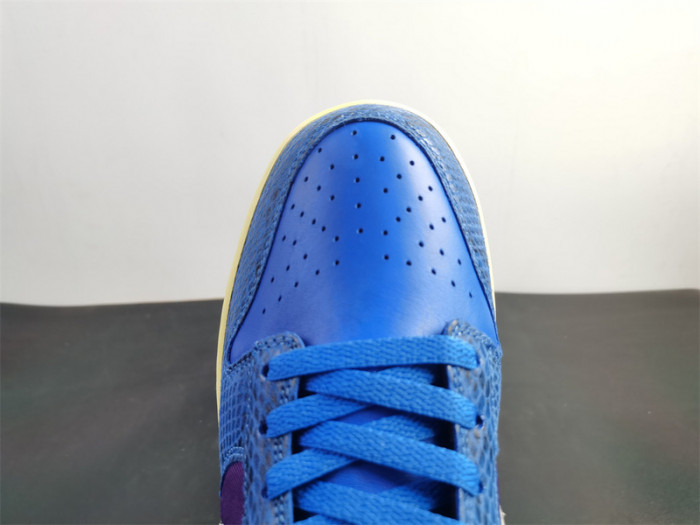 undefeated’s “dunk vs. af-1” collection grows with this snakeskin-dressed   dh6508-400
