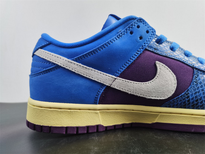 undefeated’s “dunk vs. af-1” collection grows with this snakeskin-dressed   dh6508-400
